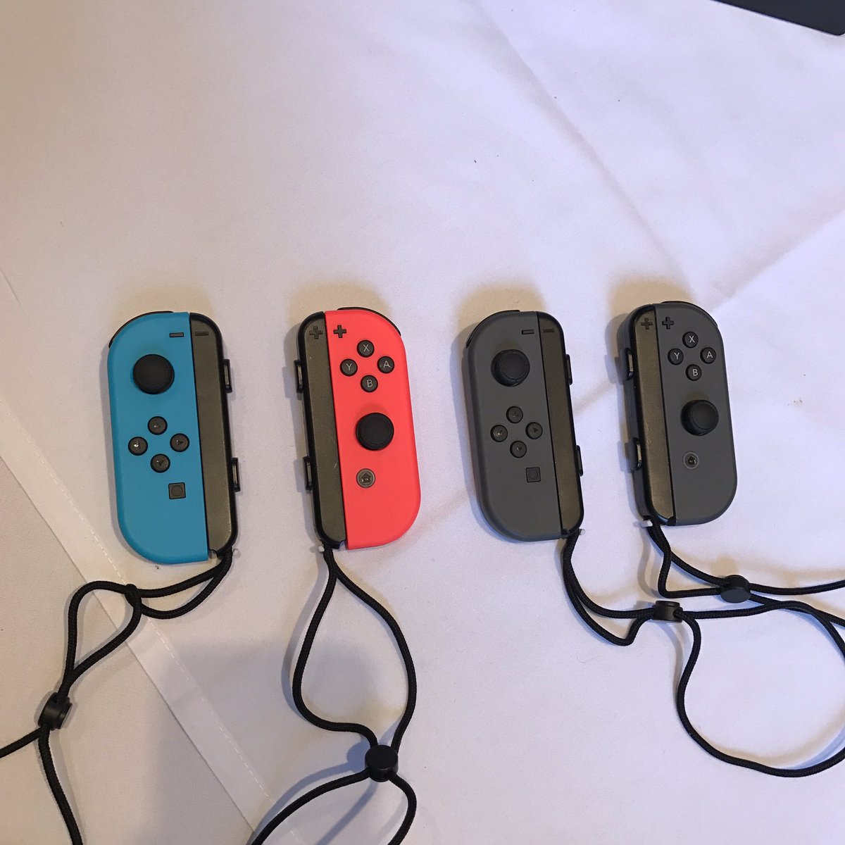 Two versions of the Nintendo Switch's Joy Con controllers